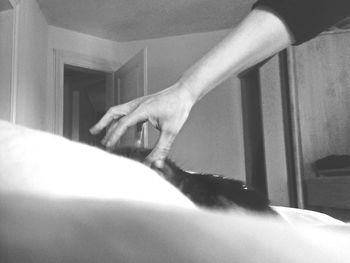 Close-up of man relaxing on wall