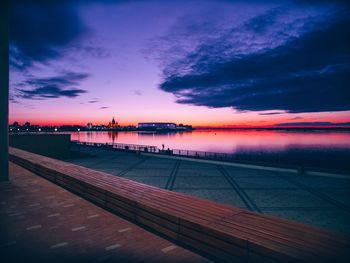 Scenic view of swimming pool against sky at sunset