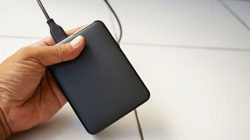 Close-up of person holding mobile phone