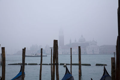 Panoramic view of sea and buildings against sky