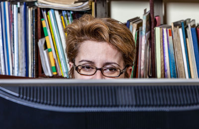 Close-up of woman working at office