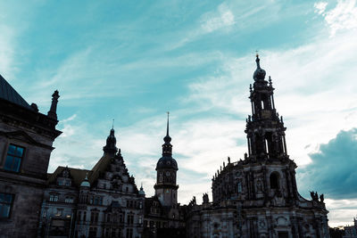 Low angle view of church against cloudy sky