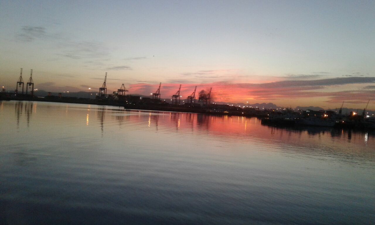 VIEW OF CITY AT WATERFRONT DURING SUNSET