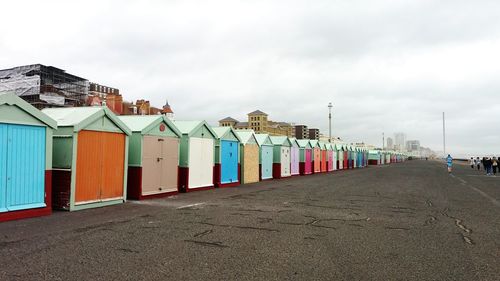 View of multi colored houses against sky