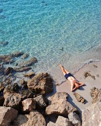 High angle view of man standing on beach