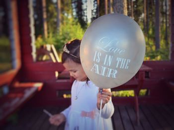 Full length of a boy holding balloon