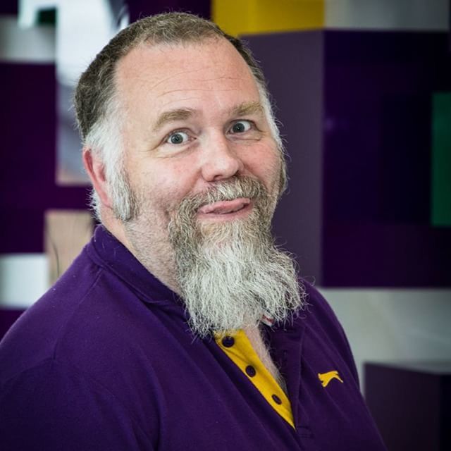 portrait, looking at camera, front view, person, headshot, lifestyles, young men, casual clothing, focus on foreground, young adult, smiling, beard, handsome, mid adult men, waist up, leisure activity, head and shoulders, close-up