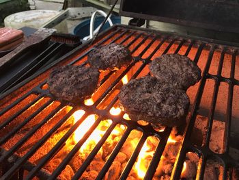 High angle view of meat on barbecue grill