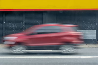 Blurred motion of car on road