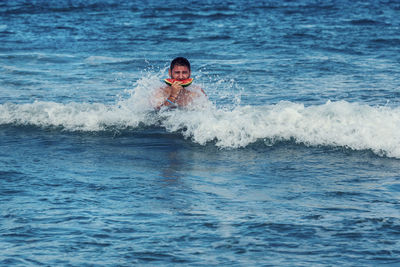 Portrait of man swimming in sea