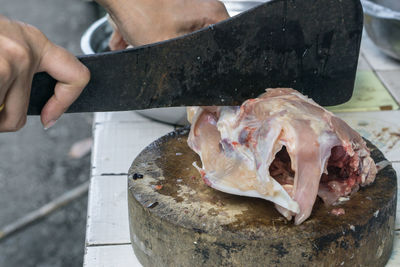 Midsection of man holding fish