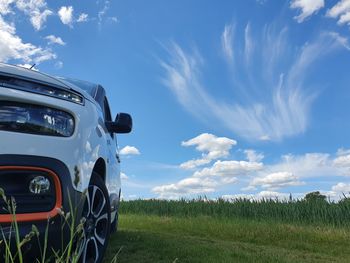 Panoramic view of agricultural field against sky