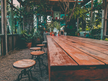 Empty wooden table in yard