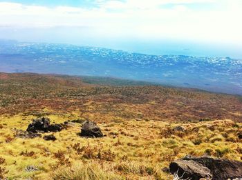 High angle view of calm sea against mountain range