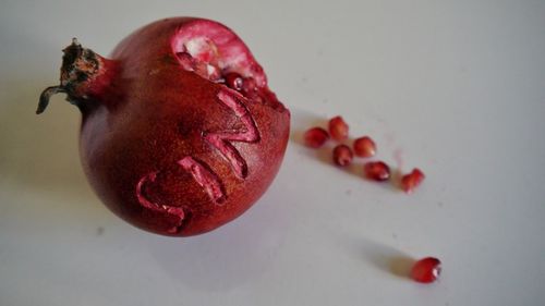 Close-up of text carved on pomegranate