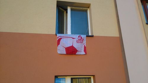 Low angle view of clothes drying on building