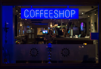 Text on illuminated store