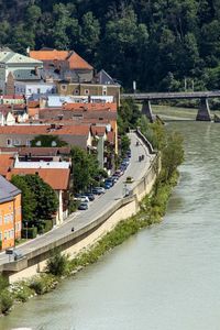 High angle view of canal by buildings in city