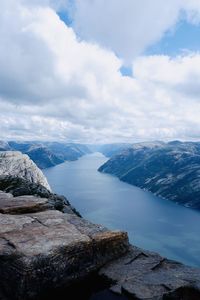 Scenic view of lake and mountains against sky in lysefjorden, norway