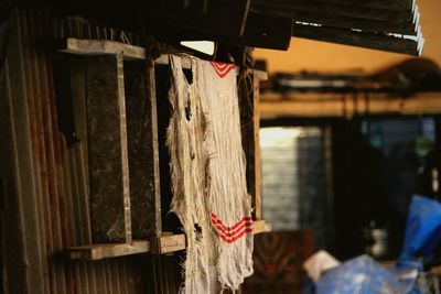 Weathered cloth hanging on ladder