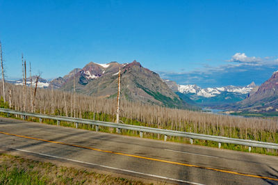 Scenic view of mountains against clear blue sky