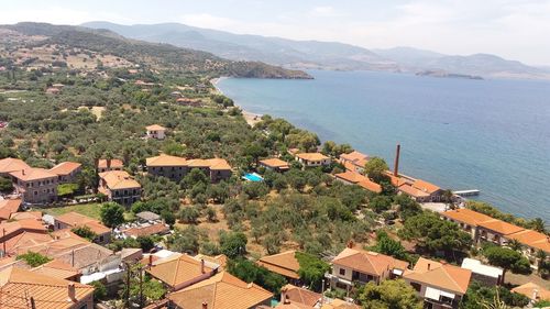 High angle view of townscape by sea