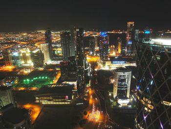 Illuminated city street at night