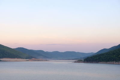 Scenic view of sea against clear sky during sunset