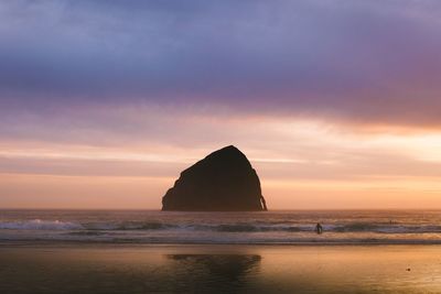 Scenic view of sea against sky at sunset