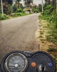 Close-up of car on road