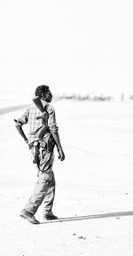 Full length of man walking on beach