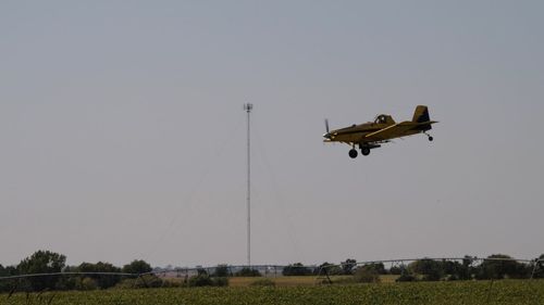 Low angle view of airplane flying against clear sky