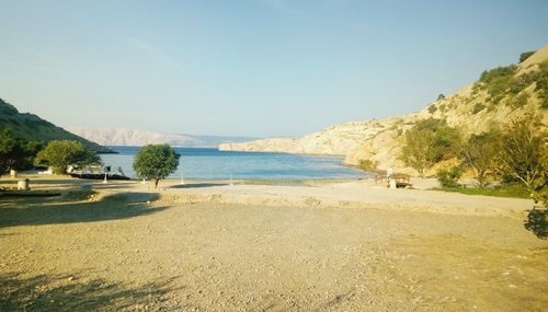 Scenic view of beach against clear sky