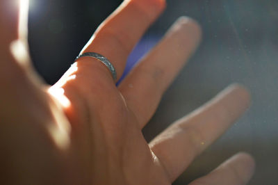 Close-up of hand wearing ring
