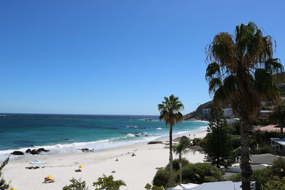 Scenic view of sea against clear blue sky