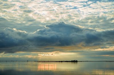 Scenic view of lagoon against dramatic sky