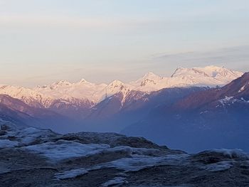 Scenic view of snowcapped mountains against sky