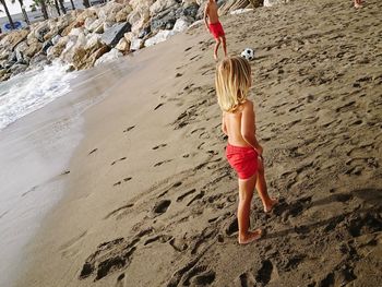 Rear view of woman on beach