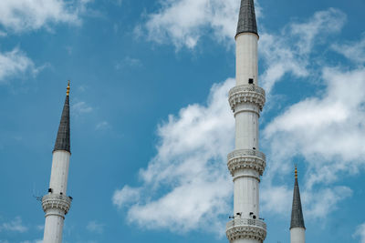 Low angle view of mosque minaret against sky