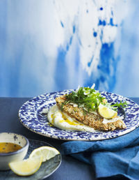 Fried fish with arugula