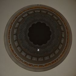 Close-up of circular object on wall