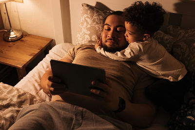 Man using mobile phone at home