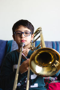 Portrait of boy playing with eyeglasses