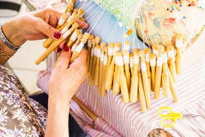 Midsection of woman holding umbrella