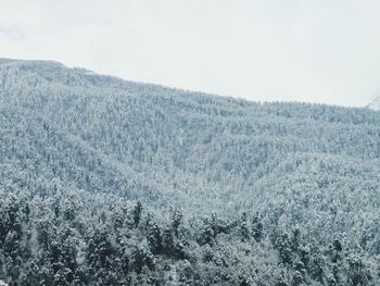 Scenic view of snow covered mountain against sky