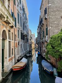 Boats moored at harbor