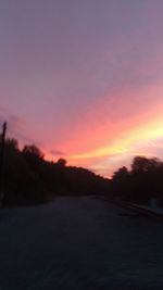 Scenic view of silhouette landscape against sky at sunset