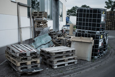 Stack of garbage by building in city