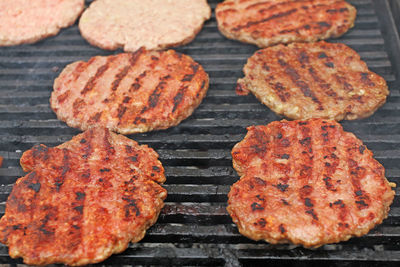 High angle view of meat on barbecue grill