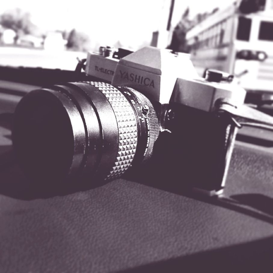 CLOSE-UP OF CAMERA ON MIRROR